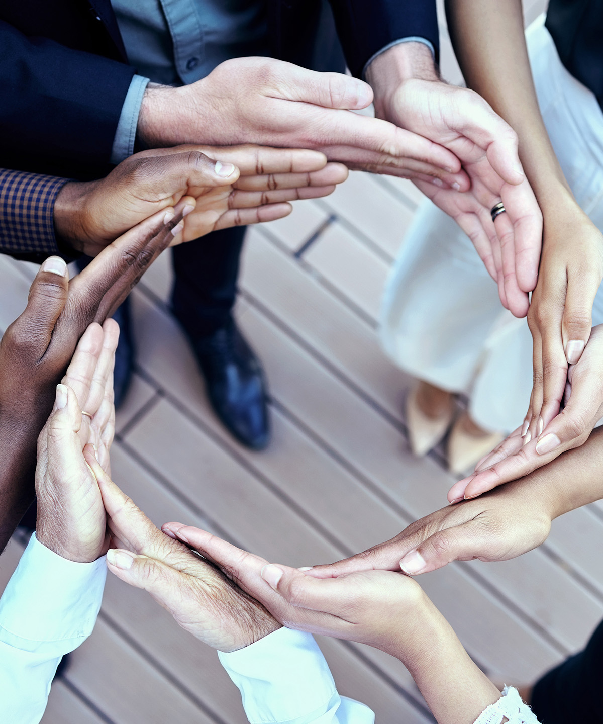 Businesspeople making a circle with their hands.