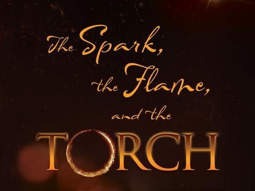 A card that says "The Spark, the Flame, and the Torch" on it.